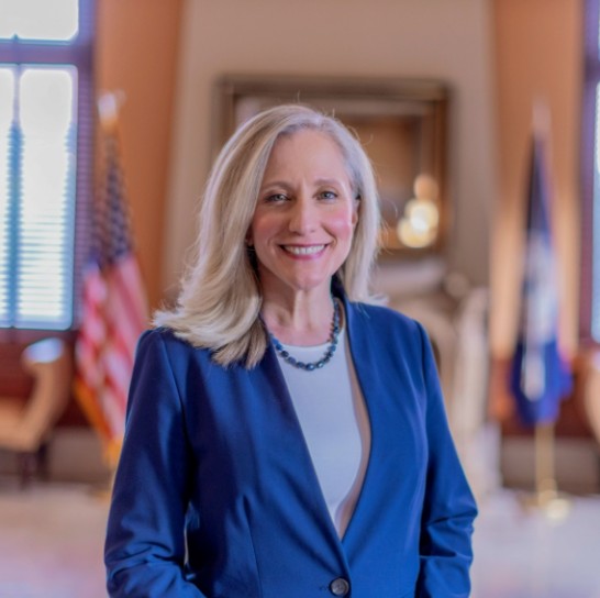 A photo of Abigail Spanberger smiling.